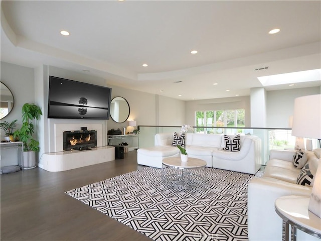 2637 Via Olivera, Palos Verdes Estates, CA 90274 - living room with recessed lighting, a warm lit fireplace, wood finished floors, and a skylight