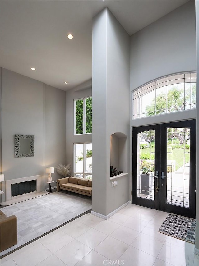 2637 Via Olivera, Palos Verdes Estates, CA 90274 - entrance foyer featuring a towering ceiling, french doors, recessed lighting, tile patterned floors, and a fireplace