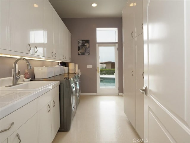 2637 Via Olivera, Palos Verdes Estates, CA 90274 - laundry room with independent washer and dryer, cabinet space, recessed lighting, and baseboards