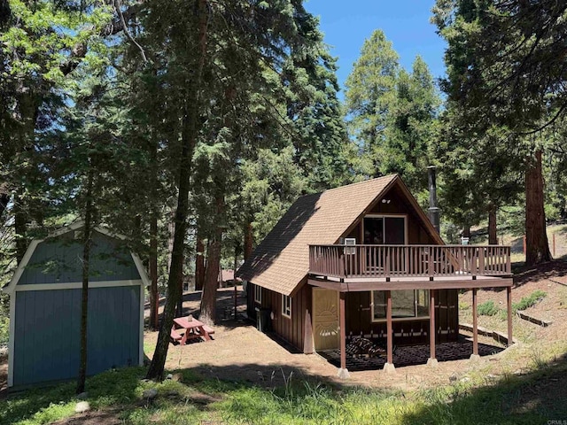 21803 Crestline Rd, Palomar Mountain, CA 92060 - back of house featuring a deck, a shed, and roof with shingles