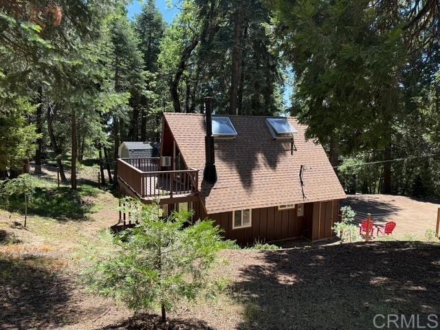 21803 Crestline Rd, Palomar Mountain, CA 92060 - view of side of property featuring board and batten siding, a wooden deck, and a shingled roof