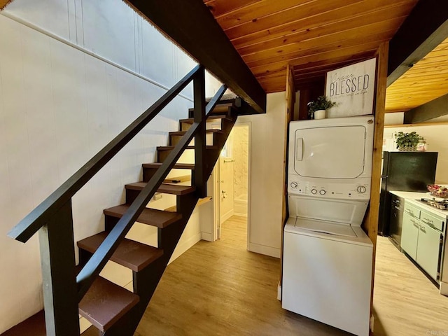 21803 Crestline Rd, Palomar Mountain, CA 92060 - laundry room with stacked washer / dryer, light wood finished floors, and wood ceiling