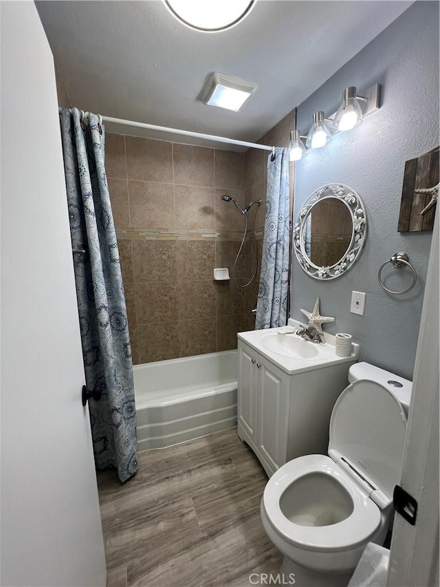 14726 Osage Rd, Apple Valley, CA 92307 - bathroom featuring shower / bath combo, vanity, and wood finished floors