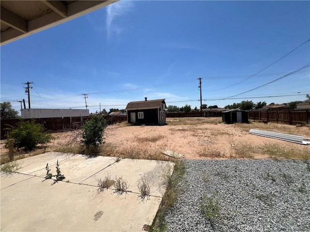 14726 Osage Rd, Apple Valley, CA 92307 - view of yard with a shed and a patio area