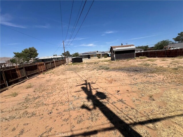 14726 Osage Rd, Apple Valley, CA 92307 - view of yard with a storage unit
