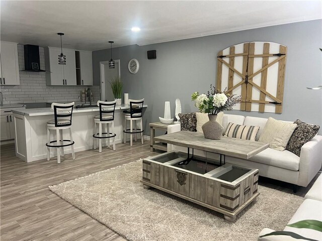 14726 Osage Rd, Apple Valley, CA 92307 - living room featuring light wood finished floors
