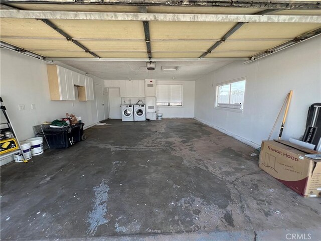 14726 Osage Rd, Apple Valley, CA 92307 - garage with separate washer and dryer and a garage door opener