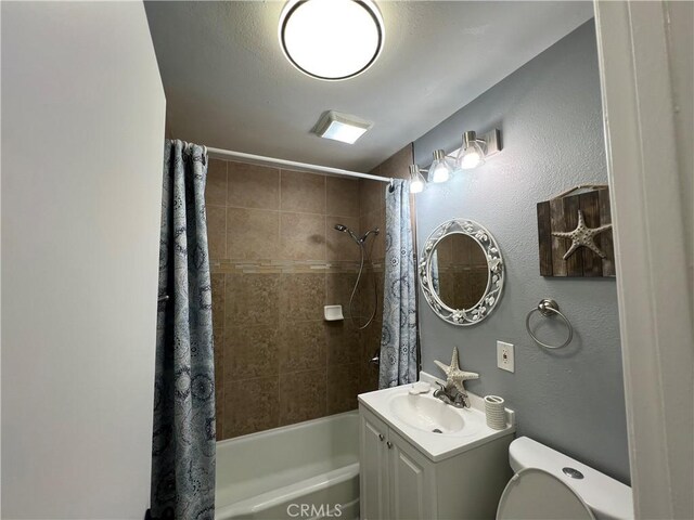 14726 Osage Rd, Apple Valley, CA 92307 - bathroom featuring shower / bath combo, vanity, and a textured wall
