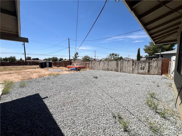 14726 Osage Rd, Apple Valley, CA 92307 - view of yard featuring a storage shed