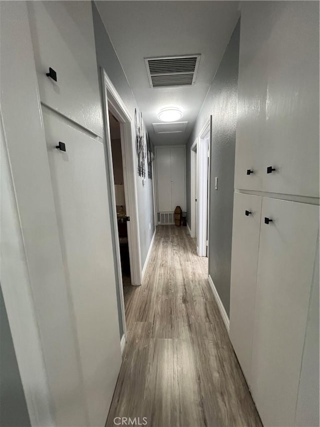 14726 Osage Rd, Apple Valley, CA 92307 - corridor with wood finished floors and baseboards