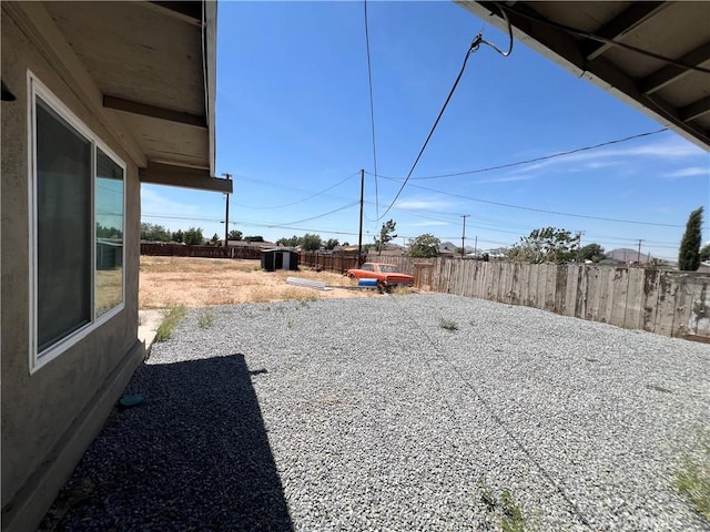 14726 Osage Rd, Apple Valley, CA 92307 - view of yard featuring a storage shed