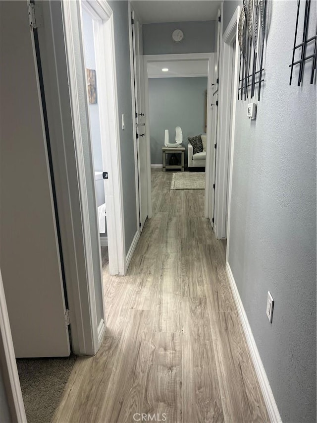 14726 Osage Rd, Apple Valley, CA 92307 - hallway with light wood-style floors and baseboards