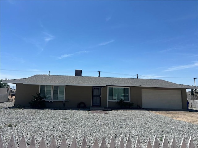 14726 Osage Rd, Apple Valley, CA 92307 - ranch-style home featuring a garage, driveway, and stucco siding