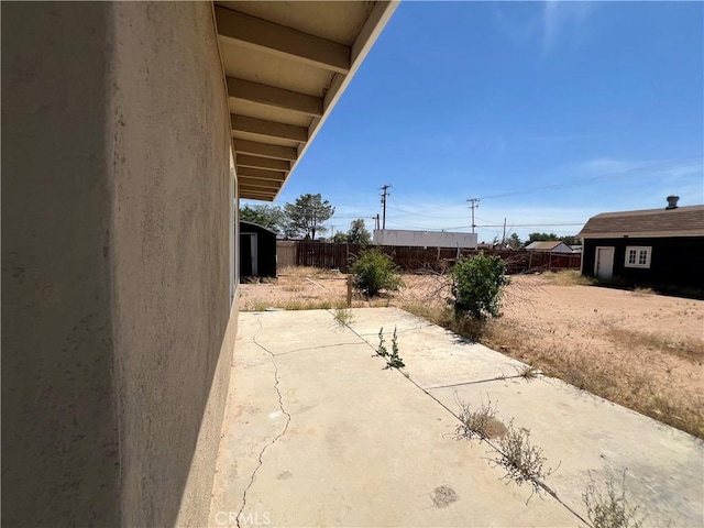 14726 Osage Rd, Apple Valley, CA 92307 - view of patio with an outbuilding
