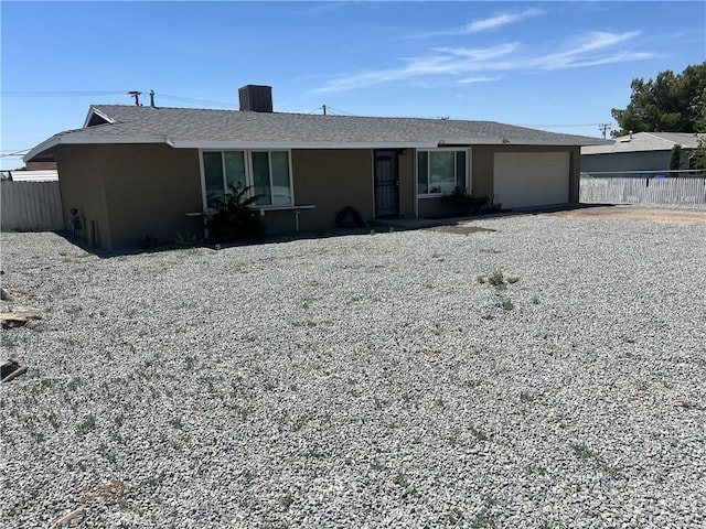 14726 Osage Rd, Apple Valley, CA 92307 - single story home with an attached garage, driveway, and stucco siding