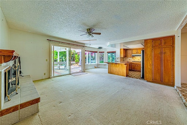 1736 Island Dr, Fullerton, CA 92833 - unfurnished living room with a ceiling fan, light carpet, a textured ceiling, and a sink
