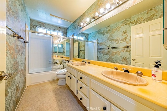 1736 Island Dr, Fullerton, CA 92833 - bathroom with toilet, double vanity, shower / bath combination with glass door, and wallpapered walls