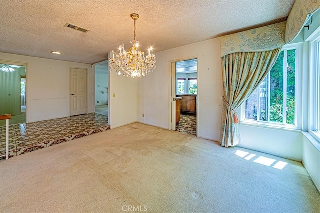1736 Island Dr, Fullerton, CA 92833 - empty room with a chandelier, carpet floors, healthy amount of natural light, and a textured ceiling