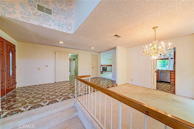 1736 Island Dr, Fullerton, CA 92833 - entrance foyer featuring a textured ceiling, a chandelier, and carpet