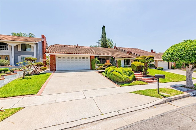 1736 Island Dr, Fullerton, CA 92833 - view of front of property with a tiled roof, an attached garage, concrete driveway, brick siding, and a front yard