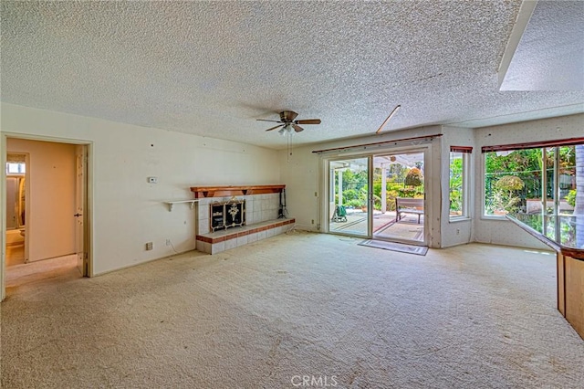 1736 Island Dr, Fullerton, CA 92833 - unfurnished living room featuring a textured ceiling, ceiling fan, carpet, and a fireplace