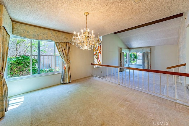 1736 Island Dr, Fullerton, CA 92833 - carpeted empty room featuring a textured ceiling, a chandelier, plenty of natural light, and vaulted ceiling
