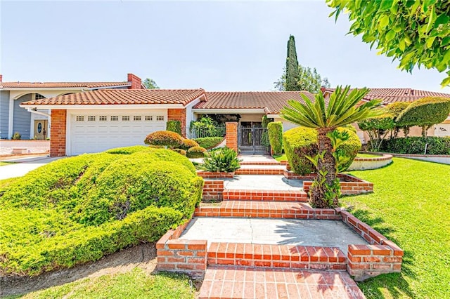 1736 Island Dr, Fullerton, CA 92833 - mediterranean / spanish house with a tiled roof, an attached garage, brick siding, a chimney, and a front lawn
