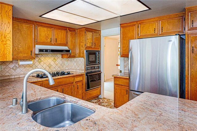 1736 Island Dr, Fullerton, CA 92833 - kitchen featuring black appliances, a sink, range hood, and brown cabinets