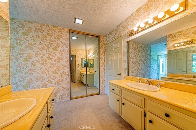 1736 Island Dr, Fullerton, CA 92833 - bathroom with wallpapered walls, two vanities, and a textured ceiling
