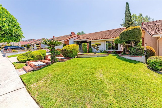 1736 Island Dr, Fullerton, CA 92833 - view of front of property featuring stucco siding, a front yard, and a tile roof