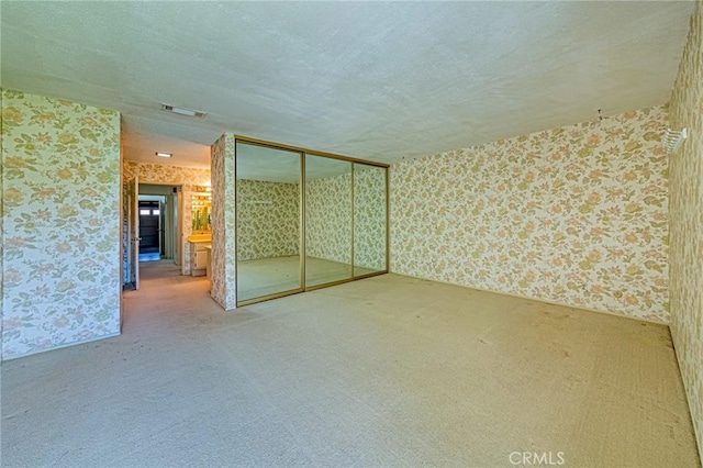 1736 Island Dr, Fullerton, CA 92833 - spare room with wallpapered walls, carpet, and a textured ceiling