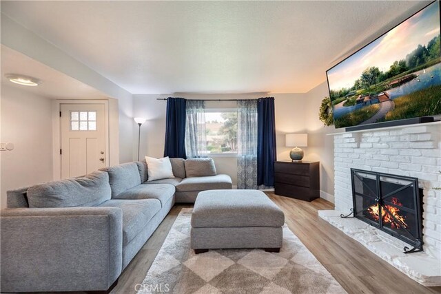 20869 Moonlake St, Walnut, CA 91789 - living area with a fireplace and light wood finished floors