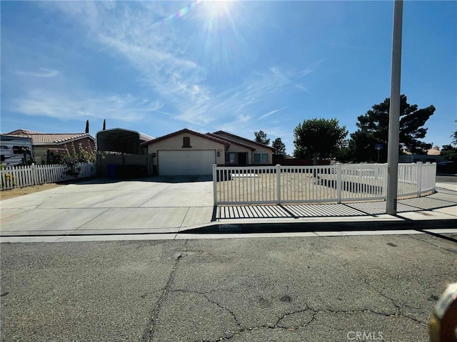 14462 Ivy St, Adelanto, CA 92301 - view of front facade featuring driveway and an attached garage
