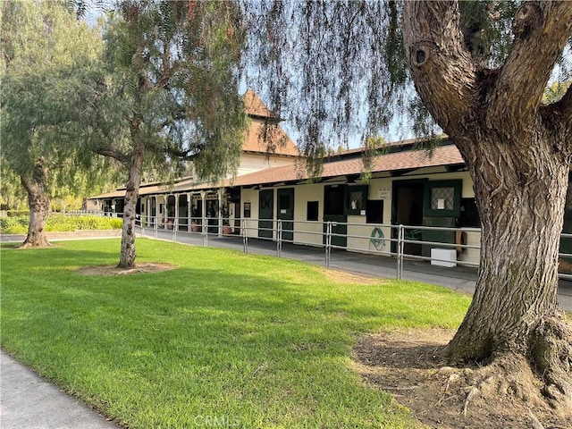 5341 Bahia Blanca W Unit C, Laguna Woods, CA 92637 - view of front of home with an exterior structure and roof with shingles