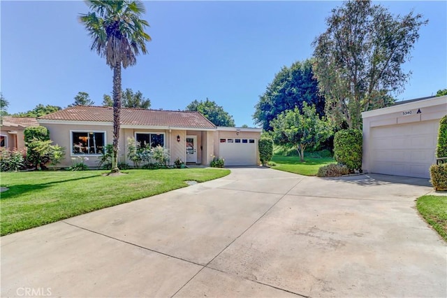 5341 Bahia Blanca W Unit C, Laguna Woods, CA 92637 - single story home with driveway, a garage, stucco siding, and a tiled roof