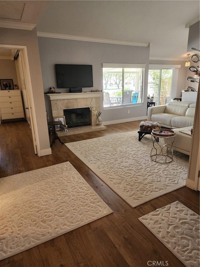 5461 W Palmer Dr, Banning, CA 92220 - living area featuring baseboards, ornamental molding, a tile fireplace, and wood finished floors