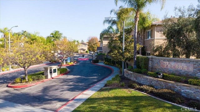 26426 Arboretum Way Unit 806, Murrieta, CA 92563 - view of asphalt road featuring curbs, street lighting, and sidewalks