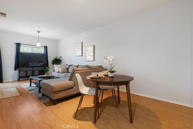 26426 Arboretum Way Unit 806, Murrieta, CA 92563 - living room featuring light wood-style flooring and baseboards