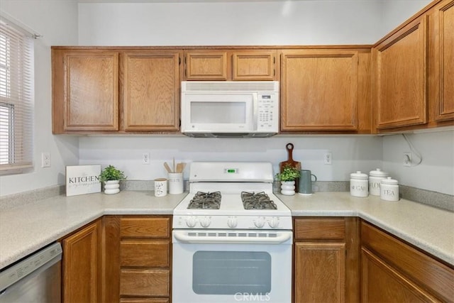 26426 Arboretum Way Unit 806, Murrieta, CA 92563 - kitchen featuring white appliances, brown cabinets, and light countertops