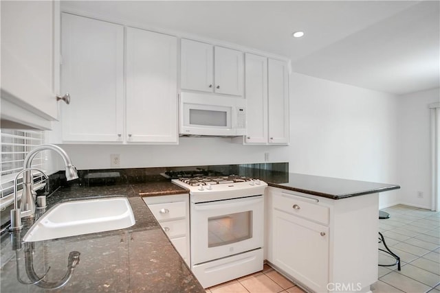 806 E Laurel Oak Dr, Azusa, CA 91702 - kitchen featuring white appliances, a peninsula, white cabinets, light tile patterned floors, and recessed lighting