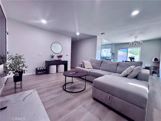 2969 Crestwood Pl, Riverside, CA 92503 - living room with light wood-style flooring, recessed lighting, a chandelier, and baseboards