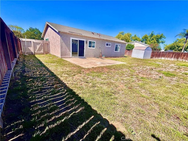 2969 Crestwood Pl, Riverside, CA 92503 - rear view of house featuring stucco siding, a patio area, and a gate