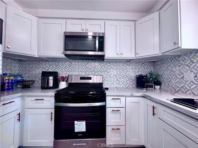 2969 Crestwood Pl, Riverside, CA 92503 - kitchen featuring stainless steel appliances, white cabinets, decorative backsplash, and light stone counters