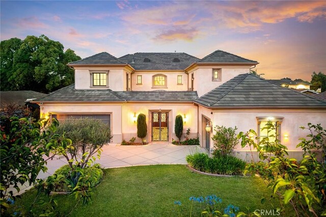 2600 S 2nd Ave, Arcadia, CA 91006 - french country inspired facade with french doors, stucco siding, driveway, and a front lawn