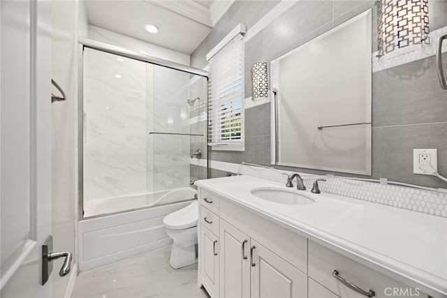 2600 S 2nd Ave, Arcadia, CA 91006 - full bathroom with tile walls, marble look tile flooring, combined bath / shower with glass door, vanity, and recessed lighting