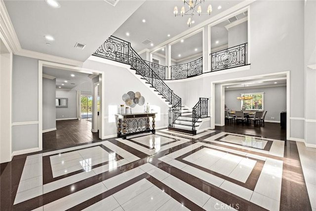 2600 S 2nd Ave, Arcadia, CA 91006 - foyer entrance with a chandelier, stairs, inlaid floor details, a high ceiling, and recessed lighting