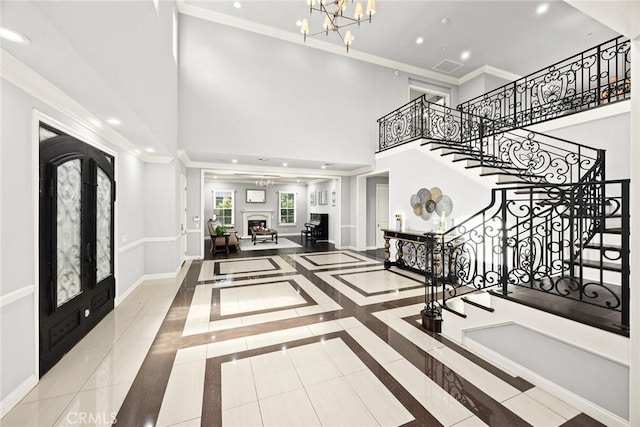 2600 S 2nd Ave, Arcadia, CA 91006 - tiled entrance foyer with french doors, stairs, crown molding, recessed lighting, and a chandelier