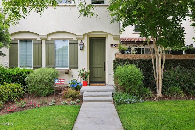3224 Lisbon Ln, Oxnard, CA 93036 - entrance to property featuring stucco siding and a lawn