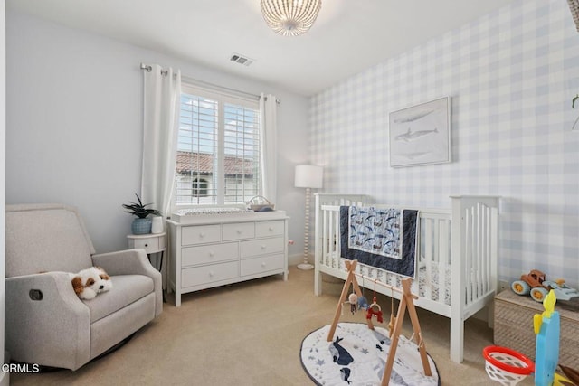 3224 Lisbon Ln, Oxnard, CA 93036 - bedroom featuring a crib, light carpet, and wallpapered walls