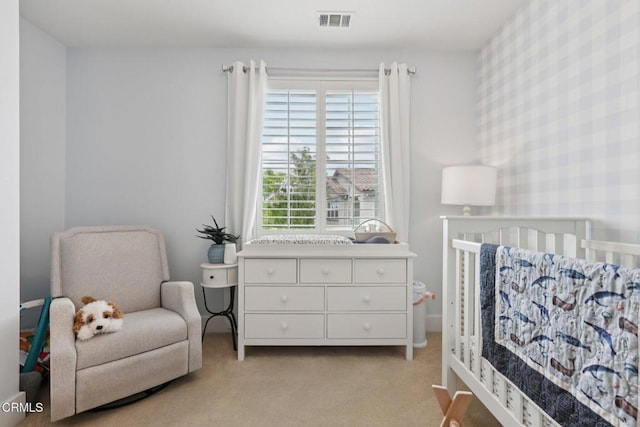 3224 Lisbon Ln, Oxnard, CA 93036 - bedroom with wallpapered walls, light colored carpet, and a nursery area
